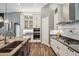 Bright kitchen features stainless appliances, light backsplash, granite countertops and storage at 3326 Barbour Trl, Odessa, FL 33556