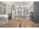 Modern kitchen with large island, stainless steel appliances, and custom cabinetry at 3326 Barbour Trl, Odessa, FL 33556