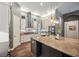 Bright kitchen with a large island, modern appliances, granite countertops and breakfast bar at 3326 Barbour Trl, Odessa, FL 33556