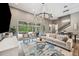 Spacious living room with pool views, natural light, modern decor, and comfortable seating at 3326 Barbour Trl, Odessa, FL 33556