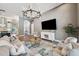 Bright living room with neutral tones, decorative rug, and comfortable seating arrangement at 3326 Barbour Trl, Odessa, FL 33556