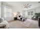 Bright main bedroom with neutral colors and several windows at 3326 Barbour Trl, Odessa, FL 33556