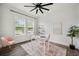 Bright home office with shiplap walls, modern ceiling fan, and a large window at 3326 Barbour Trl, Odessa, FL 33556