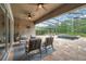 Covered outdoor patio with travertine tile, ceiling fan, outdoor furniture, and views of the pool at 3326 Barbour Trl, Odessa, FL 33556