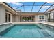 Enjoy this screened-in pool with an outdoor seating area, perfect for relaxing and entertaining in style at 3326 Barbour Trl, Odessa, FL 33556