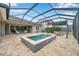 Screened-in pool and patio area with an outdoor dining area and lounge seating for entertaining and relaxation at 3326 Barbour Trl, Odessa, FL 33556