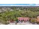 Aerial view of condominium building with mature trees and ample parking in a well-kept community at 3620 41St S Way # B, St Petersburg, FL 33711