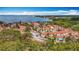 Aerial image featuring waterfront views, colorful community buildings, and trees at 3620 41St S Way # B, St Petersburg, FL 33711