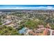Aerial view of community with recreational area and pool surrounded by mature trees near the water at 3620 41St S Way # B, St Petersburg, FL 33711