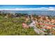 Scenic aerial showcasing colorful condos, parking, trees and a glimpse of the bay at 3620 41St S Way # B, St Petersburg, FL 33711