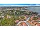 Scenic aerial view showing the neighborhood with lush greenery and glimpses of the waterfront at 3620 41St S Way # B, St Petersburg, FL 33711