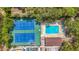 Aerial view of the community pool and tennis courts surrounded by manicured landscaping at 3620 41St S Way # B, St Petersburg, FL 33711