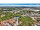 Expansive aerial view of a community with mature trees, offering a glimpse of the cityscape in the distance at 3620 41St S Way # B, St Petersburg, FL 33711