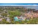 Aerial view showcasing the community's lush landscaping, pool, and tennis courts at 3620 41St S Way # B, St Petersburg, FL 33711