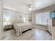 Inviting bedroom featuring hard surface floors, comfortable bedding, and calming wall art at 3620 41St S Way # B, St Petersburg, FL 33711