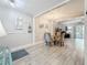View of a dining space with a modern chandelier and open to the living area at 3620 41St S Way # B, St Petersburg, FL 33711
