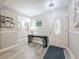 Inviting entryway with light gray walls, decorative table, and stylish front door with glass detailing at 3620 41St S Way # B, St Petersburg, FL 33711