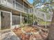 Exterior view of home featuring a screened in porch and stairway at 3620 41St S Way # B, St Petersburg, FL 33711