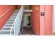 Exterior view of the condo with access stairs and a painted muted pink facade at Bermuda Bay at 3620 41St S Way # B, St Petersburg, FL 33711