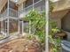 Exterior view of home featuring a screened in porch and landscaped yard at 3620 41St S Way # B, St Petersburg, FL 33711