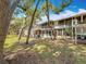 Lush outdoor setting, showcasing the building's screened porches and expansive green space at 3620 41St S Way # B, St Petersburg, FL 33711