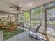 Screened lanai with comfortable seating and serene views of the surrounding landscape at 3620 41St S Way # B, St Petersburg, FL 33711
