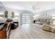 Bright living room with plank floors, a ceiling fan, and sliding glass doors leading to the lanai at 3620 41St S Way # B, St Petersburg, FL 33711