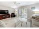 Comfortable living area with patio access, offering a relaxing space with ample light at 3620 41St S Way # B, St Petersburg, FL 33711