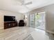 Cozy living area with hard surface floors, patio access, and plenty of space to relax at 3620 41St S Way # B, St Petersburg, FL 33711