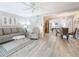 Inviting living room with hard surface floors, neutral walls, ceiling fan, and modern furnishings at 3620 41St S Way # B, St Petersburg, FL 33711