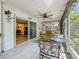 Inviting screened in lanai featuring comfortable seating and seamless access to interior living spaces at 3620 41St S Way # B, St Petersburg, FL 33711