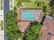 Aerial view of pool and adjacent tile roofed house at 3762 Darston St, Palm Harbor, FL 34685
