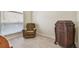 Relaxing bedroom with wood flooring, a plush chair and a cabinet at 3762 Darston St, Palm Harbor, FL 34685