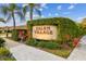 Entrance sign for Salem Village amidst lush greenery and landscaping, creating a welcoming community atmosphere at 3762 Darston St, Palm Harbor, FL 34685