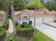 Beautiful home boasts a tile roof, well-maintained landscaping, and a spacious driveway leading to a multi-car garage at 3762 Darston St, Palm Harbor, FL 34685