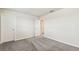 A bedroom featuring carpeted floors, neutral walls, and two entryways at 3860 Obsidian Dr, Spring Hill, FL 34609