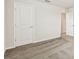 A bedroom with neutral walls, carpet flooring, and multiple entryways at 3860 Obsidian Dr, Spring Hill, FL 34609