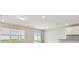 Bright living area with large windows, recessed lights and with a kitchen view at 3860 Obsidian Dr, Spring Hill, FL 34609