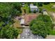 Home from above, showcasing a charming backyard deck and lots of greenery at 39542 Friends Ave, Zephyrhills, FL 33540