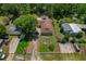 Aerial view of a home with a large yard and multiple parking spots at 39542 Friends Ave, Zephyrhills, FL 33540
