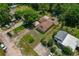 Spacious home with an ample lot featuring a backyard deck, covered patio, and mature trees at 39542 Friends Ave, Zephyrhills, FL 33540