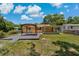 The backyard features a patio and views of the home at 39542 Friends Ave, Zephyrhills, FL 33540