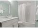 Bright bathroom featuring a tub and shower combination and a modern single sink vanity at 39542 Friends Ave, Zephyrhills, FL 33540