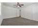 View of bedroom with ceiling fan, neutral carpeting, and white walls at 39542 Friends Ave, Zephyrhills, FL 33540