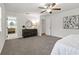 Serene main bedroom with calming decor, ceiling fan, ensuite bathroom, and walk-in closet at 39542 Friends Ave, Zephyrhills, FL 33540
