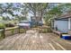 Spacious backyard wooden deck featuring built-in seating and plenty of space for outdoor gatherings and relaxation at 4016 N Seminole Ave, Tampa, FL 33603