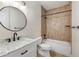 Bathroom featuring a vanity with a marble countertop, and a shower over tub at 4016 N Seminole Ave, Tampa, FL 33603