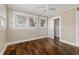Well-lit bedroom with hardwood floors, offering ample space and closet at 4016 N Seminole Ave, Tampa, FL 33603