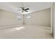 A spacious bedroom with neutral colors and a ceiling fan for added comfort at 4016 N Seminole Ave, Tampa, FL 33603