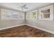 Bedroom with hardwood floors and great natural light from windows at 4016 N Seminole Ave, Tampa, FL 33603